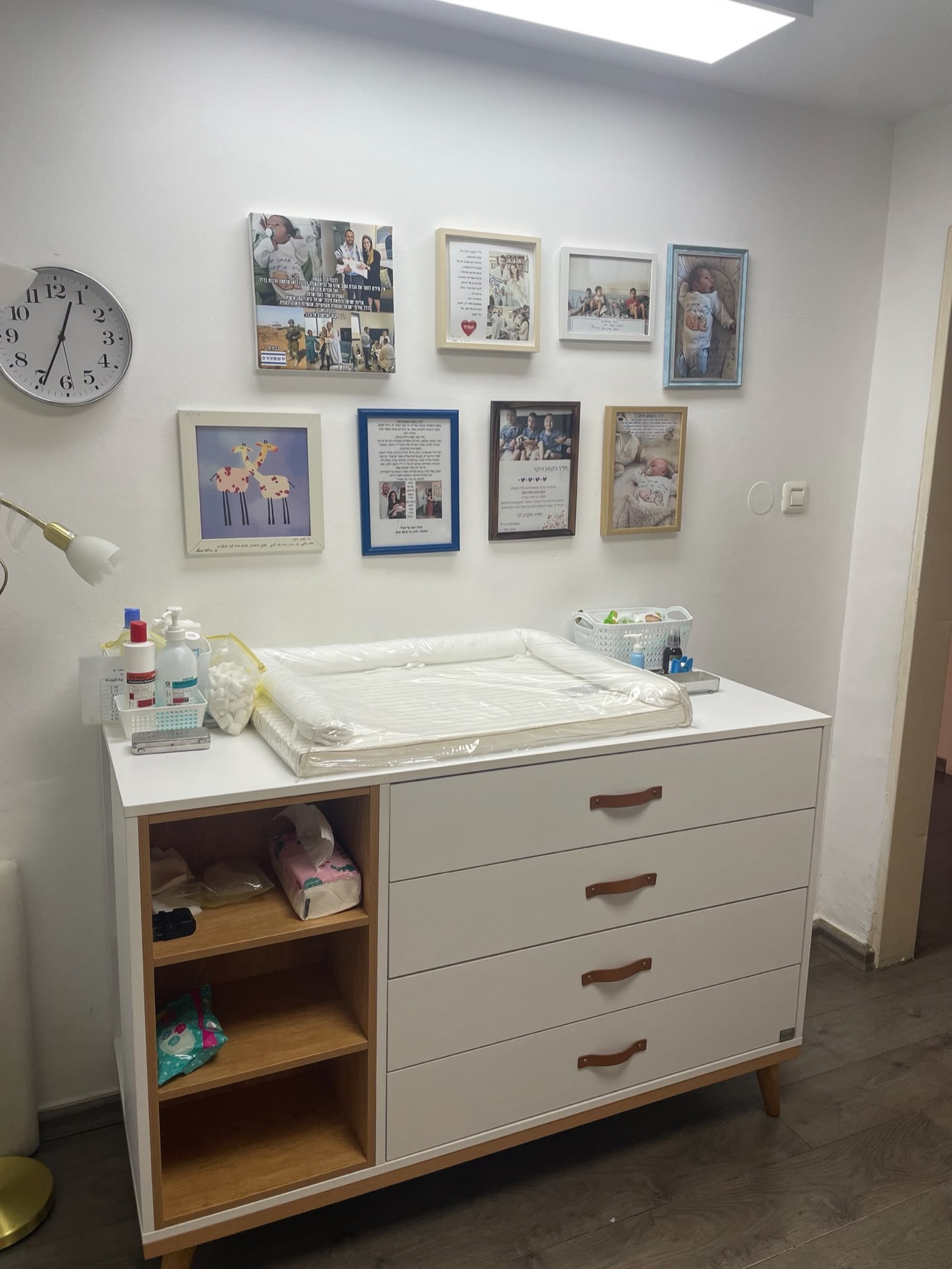 The clinic's treatment station, beside the wall of thank-you letters