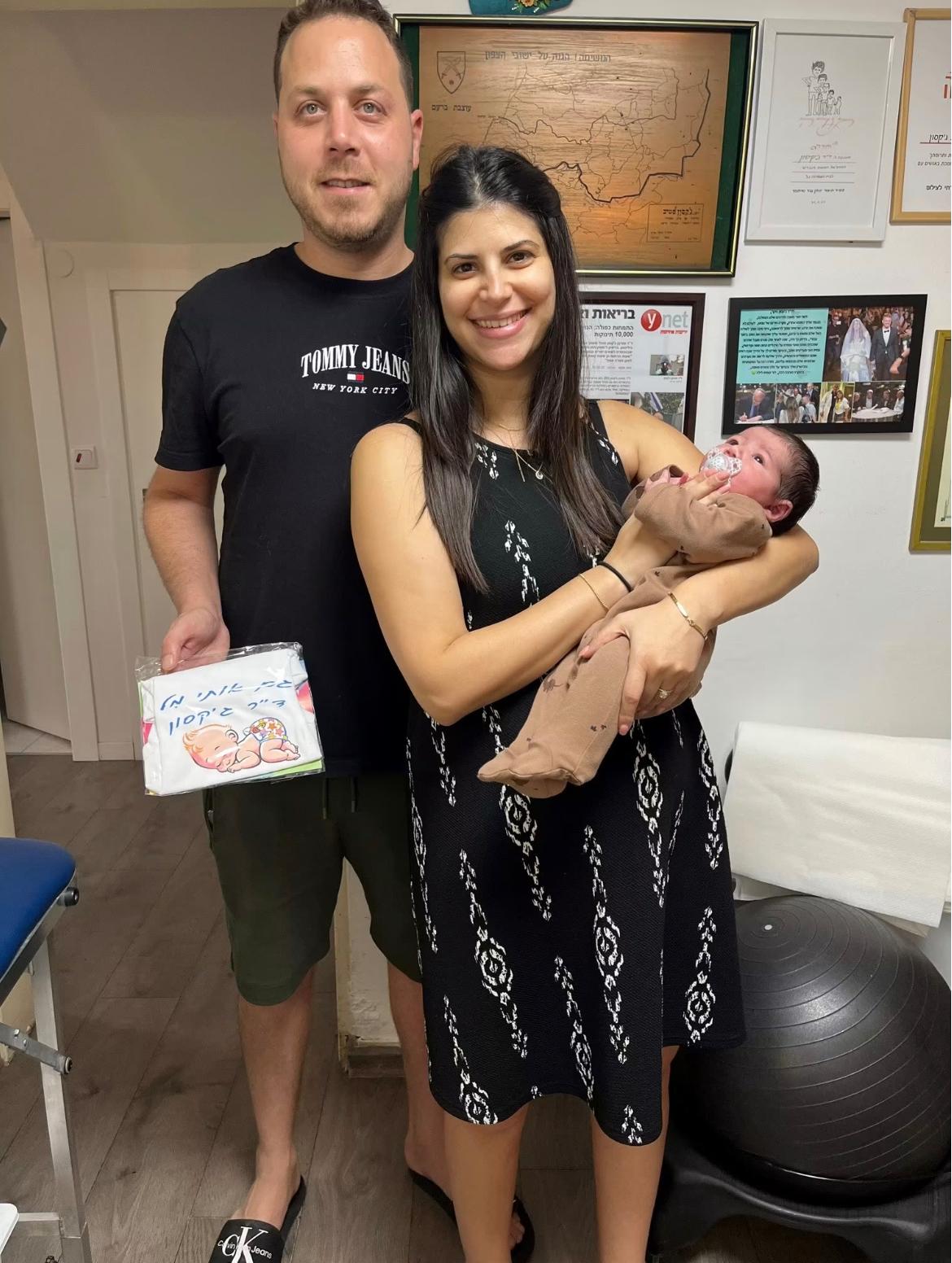 A family with their baby at the clinic